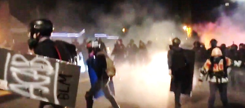 Antifa attacking a Portland Police station