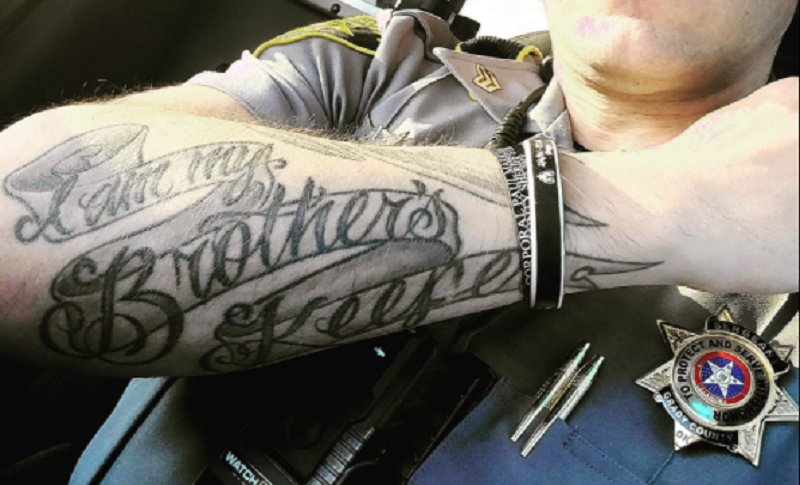 Cop put on leave for tattoo linked to antigovernment group