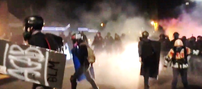 Antifa attacking a Portland Police station